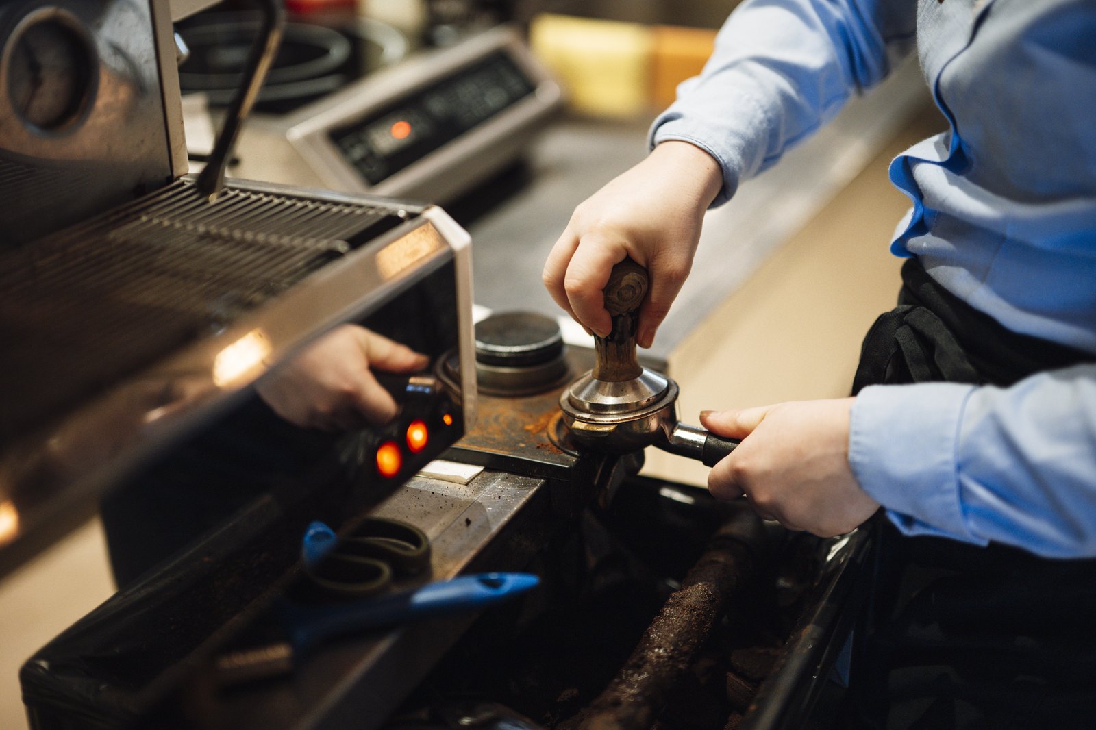 Barista pulling espresso at the roastery counter